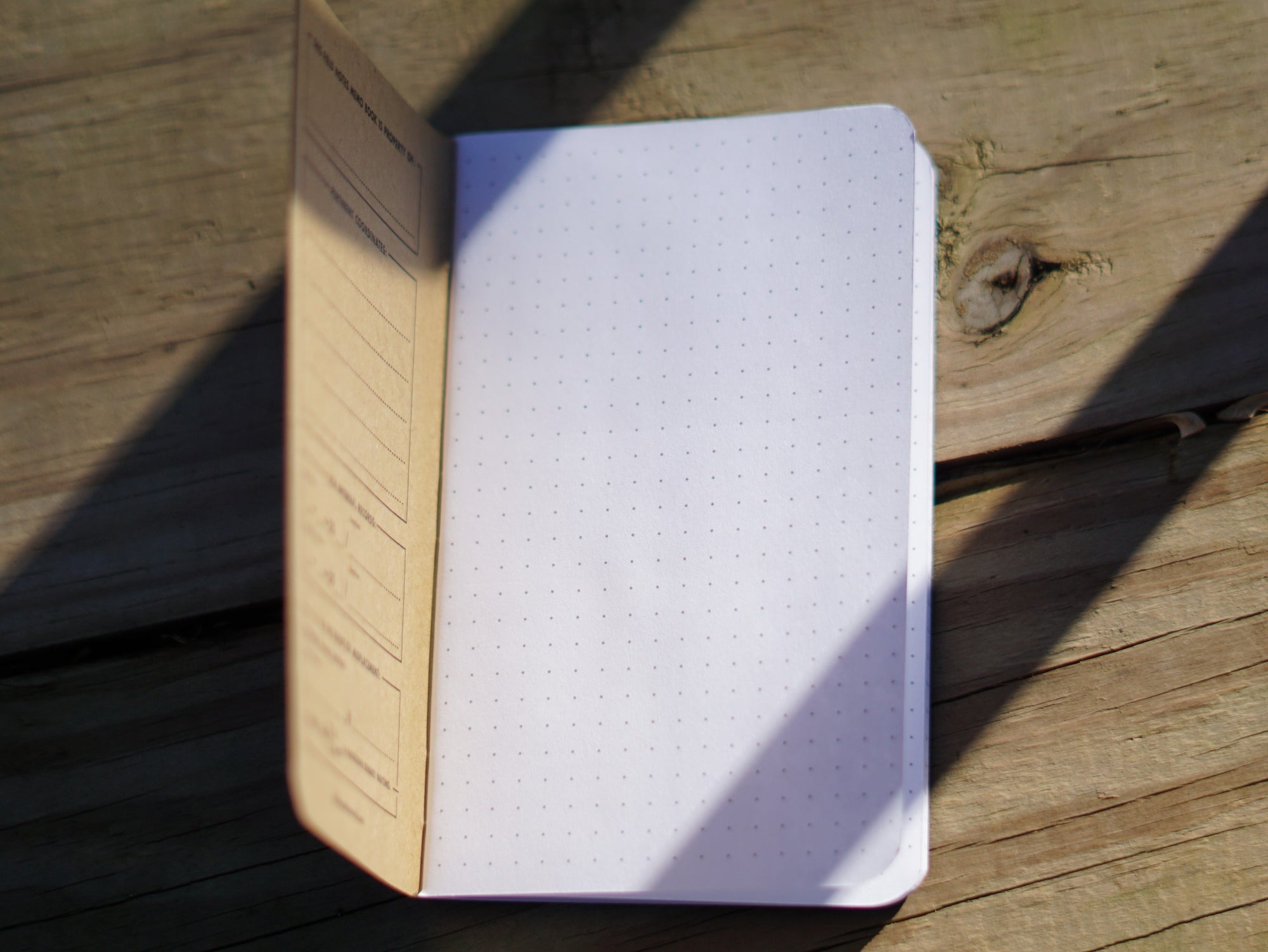 Pitch Black Field Notes open to the first page showing the dot graph