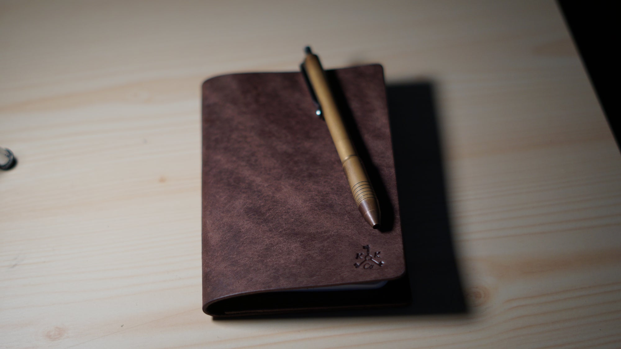 Brown Pueblo Cove moody with brass pen